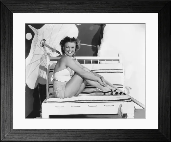 Framed Print : Simone Simon, modeling yellow sailcloth shorts, white bandana top and red patent-leather sandals, 1936 Framed Print : Simone Simon, modeling yellow sailcloth shorts, white bandana top and red patent-leather sandals, 1936
