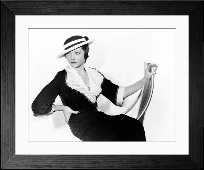 Framed Print : Sylvia Sidney in black matlasso with collar and cuffs of white faille and Mexican Poon hat, 1934 Framed Print : Sylvia Sidney in black matlasso with collar and cuffs of white faille and Mexican Poon hat, 1934
