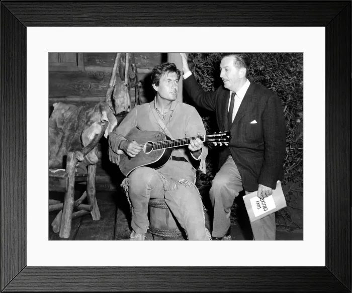 Framed Print : DAVY CROCKETT, KING OF THE WILD FRONTIER, (movie compiled from segments of TV's THE MAGICAL WORLD OF DISNEY), from left, Fess Parker, producer Walt Disney, on-set, 1955 Framed Print : DAVY CROCKETT, KING OF THE WILD FRONTIER, (movie compiled from segments of TV's THE MAGICAL WORLD OF DISNEY), from left, Fess Parker, producer Walt Disney, on-set, 1955