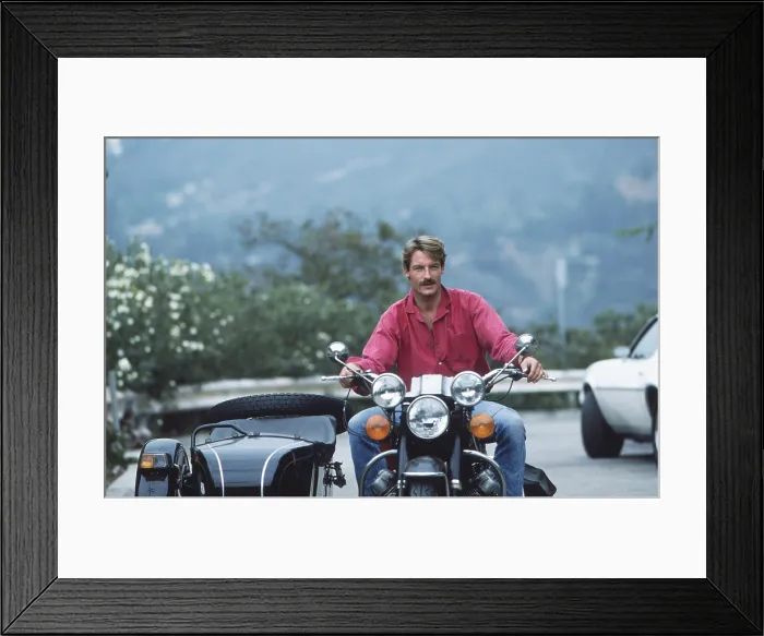 Framed Print : Perry King, on one of his motorcycles, 1985 Framed Print : Perry King, on one of his motorcycles, 1985