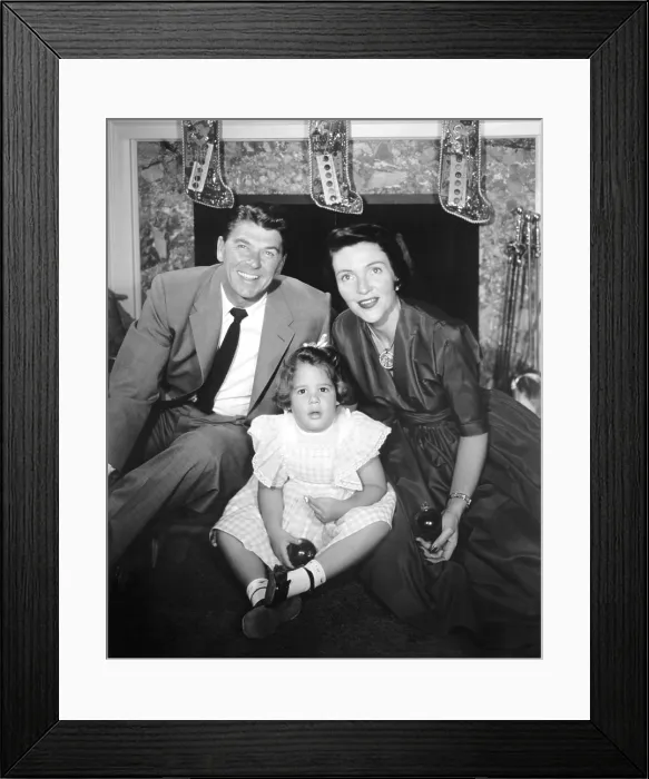 Framed Print : GENERAL ELECTRIC THEATER, from left: host Ronald Reagan, Patti Davis, Nancy Davis Reagan, A Child is Born, (Season 5, ep. 514, aired Dec. 23, 1956), 1953-62