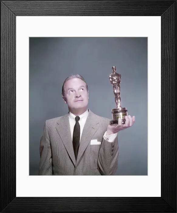 Framed Print : Bob Hope, who often hosted the Academy Awards presentation, holding an Oscar statuette, circa 1950s