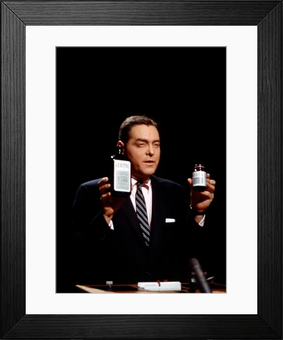 Framed Print : TWENTY-ONE, (aka 21), host Jack Barry, holding the show's sponsor, Geritol, (1957), 1956-1958