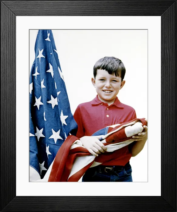 Framed Print : Jerry Mathers, showing how to correctly lower and fold an American flag, 1958