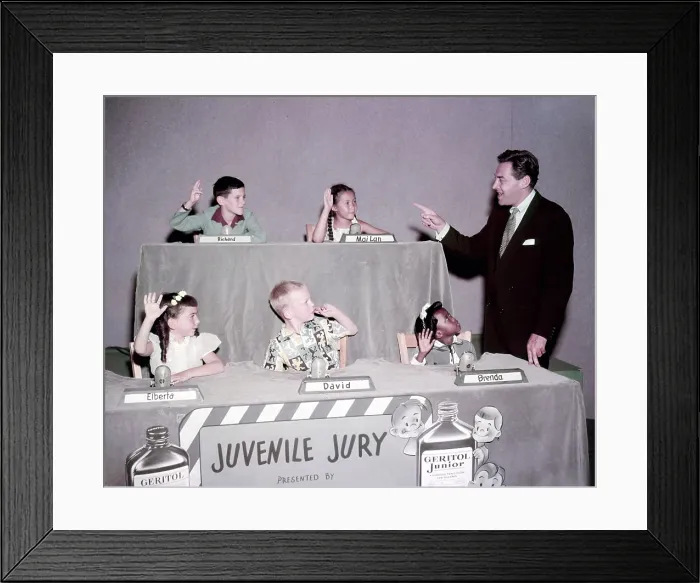 Framed Print : JUVENILE JURY, host Jack Barry (right) with child panelists, clockwise from top left: Richard, Mai-Lan, Brenda, David, and Elberta, (ca. early 1950s), 1947-1954