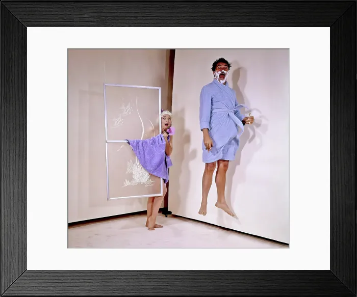 Framed Print : From left: Edie Adams, Ernie Kovacs, surprised in the shower, from a comedic photoshoot for TV Guide, May 14, 1960 Framed Print : From left: Edie Adams, Ernie Kovacs, surprised in the shower, from a comedic photoshoot for TV Guide, May 14, 1960