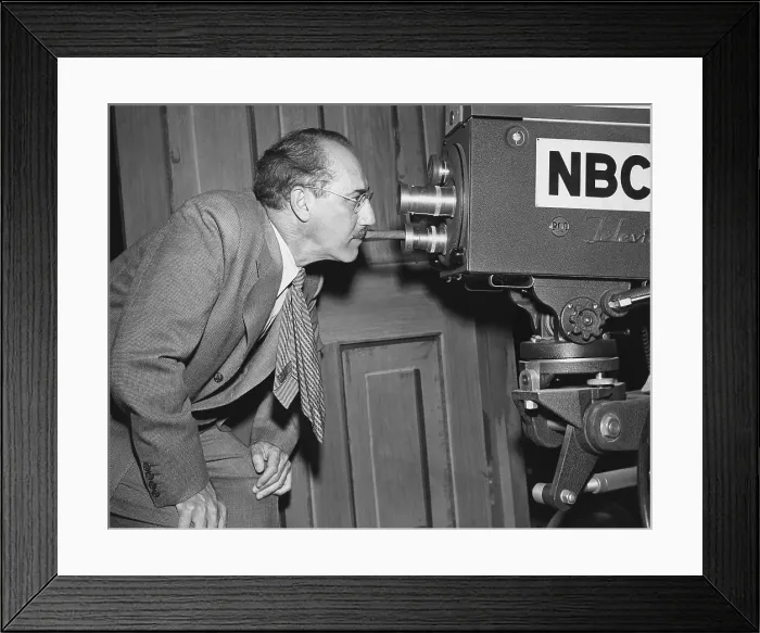 Framed Print : YOU BET YOUR LIFE, Groucho Marx (host), staring through TV camera lens, on set, 1951-1961