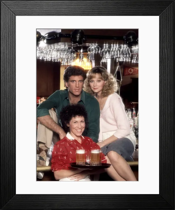 Framed Print : CHEERS, from left: Rhea Perlman (front), Ted Danson, Shelley Long, 1983, (1982-1993)