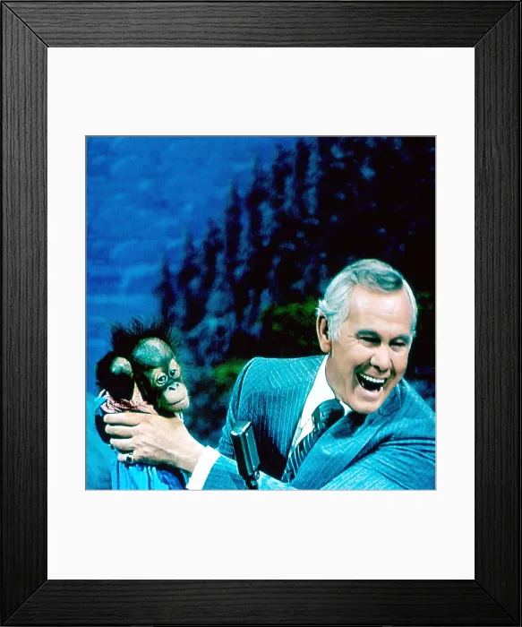 Framed Print : THE TONIGHT SHOW STARRING JOHNNY CARSON, Johnny Carson, holding a baby orangutan brought to the show by animal expert Joan Embery, (aired February 28, 1978), 1962-92 Framed Print : THE TONIGHT SHOW STARRING JOHNNY CARSON, Johnny Carson, holding a baby orangutan brought to the show by animal expert Joan Embery, (aired February 28, 1978), 1962-92