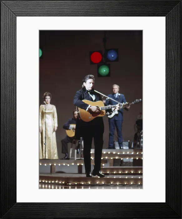 Framed Print : THE JOHNNY CASH SHOW, From left: June Carter Cash, Johnny Cash onstage, (Season 1, ep. 127, aired April 8, 1970), 1969-1971