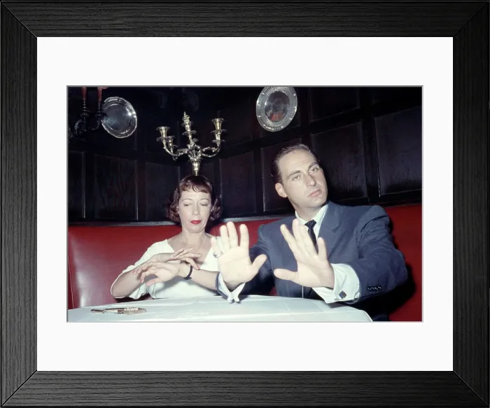 Framed Print : From left: Imogene Coca, Sid Caesar, sitting at banquette, ca. 1950s