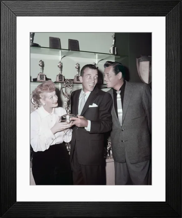 Framed Print : Ed Sullivan (center) admiring the trophy shelf of Lucille Ball and Desi Arnaz, ca. mid-1950s