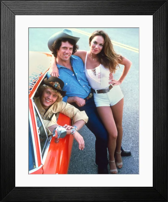 Framed Print : DUKES OF HAZZARD, Catherine Bach, Tom Wopat, John Schneider, 1979-1985 Framed Print : DUKES OF HAZZARD, Catherine Bach, Tom Wopat, John Schneider, 1979-1985