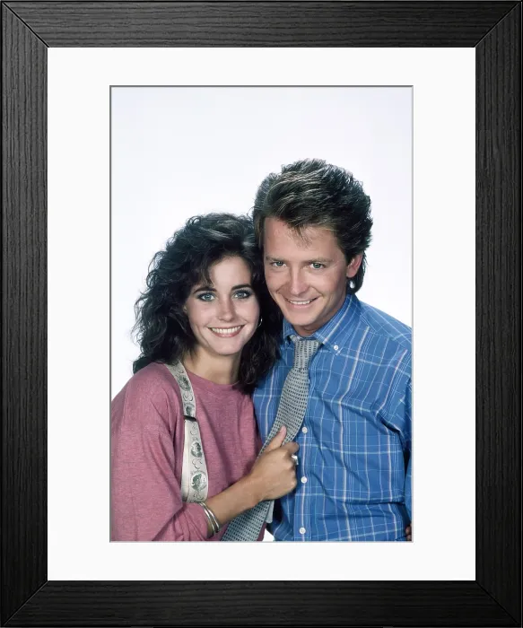 Framed Print : FAMILY TIES, from left, Courteney Cox, Michael J. Fox, 1982-89 (1987 photo)