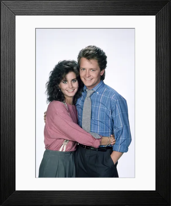 Framed Print : FAMILY TIES, from left, Courteney Cox, Michael J. Fox, 1982-89 (1987 photo)