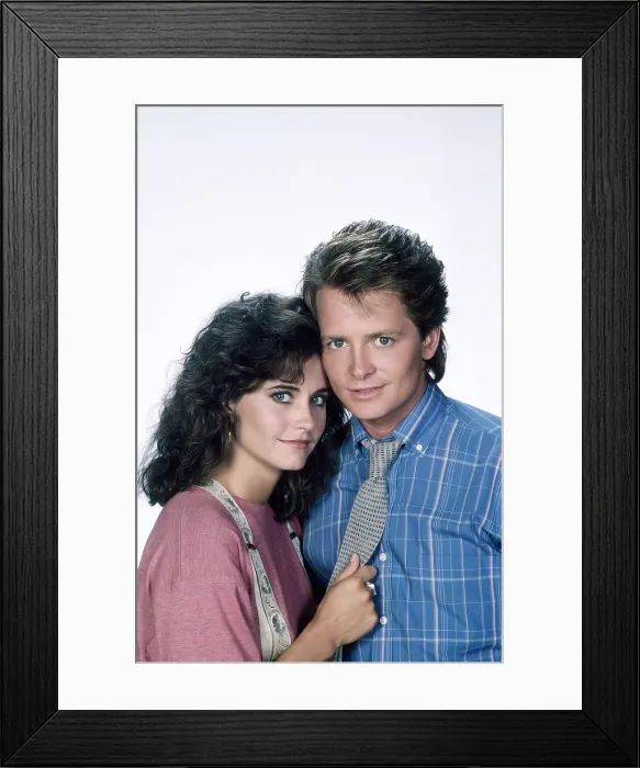 Framed Print : FAMILY TIES, from left, Courteney Cox, Michael J. Fox, 1982-89 (1987 photo)