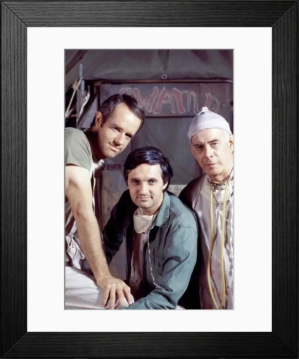Framed Print : MASH, (aka M*A*S*H*), from left: Mike Farrell, Alan Alda, Henry Morgan, (1975), 1972-1983 Framed Print : MASH, (aka M*A*S*H*), from left: Mike Farrell, Alan Alda, Henry Morgan, (1975), 1972-1983