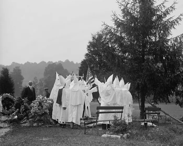 Framed Print : 1923 Ku Klux Klan funeral ritual. The KKK offered members regalia, costumes, and rituals with its racism