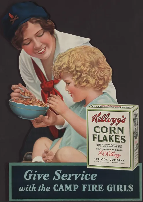 Framed Print : 1929 advertisement for Kellogg's Corn Flakes, showing a Camp Fire Girl feeding cereal to a small child Framed Print : 1929 advertisement for Kellogg's Corn Flakes, showing a Camp Fire Girl feeding cereal to a small child