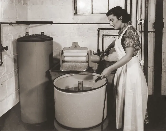 Framed Print : 1930s state of the art home laundry included a hot water heater, Hose filled wash tub with electric powered agitator and wringer