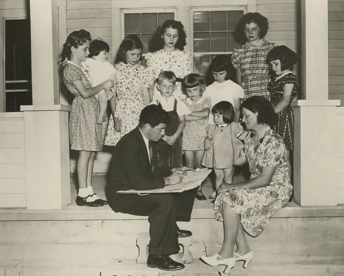Framed Print : 1940 Census taker interviewing the mother of ten children. On their front porch, the family is well dressed and looks prosperous. (BSLOC_2013_9_4)