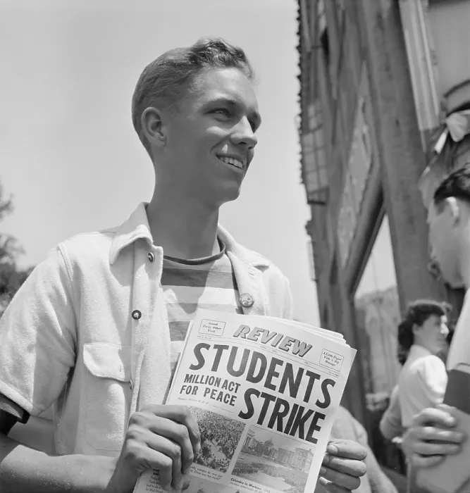 Framed Print : 1940 Peace Strike at Berkeley. Student selling Pacifist newspapers. This youth is an officer in the R.O.T.C. Reserve Officers Training Corps Framed Print : 1940 Peace Strike at Berkeley. Student selling Pacifist newspapers. This youth is an officer in the R.O.T.C. Reserve Officers Training Corps