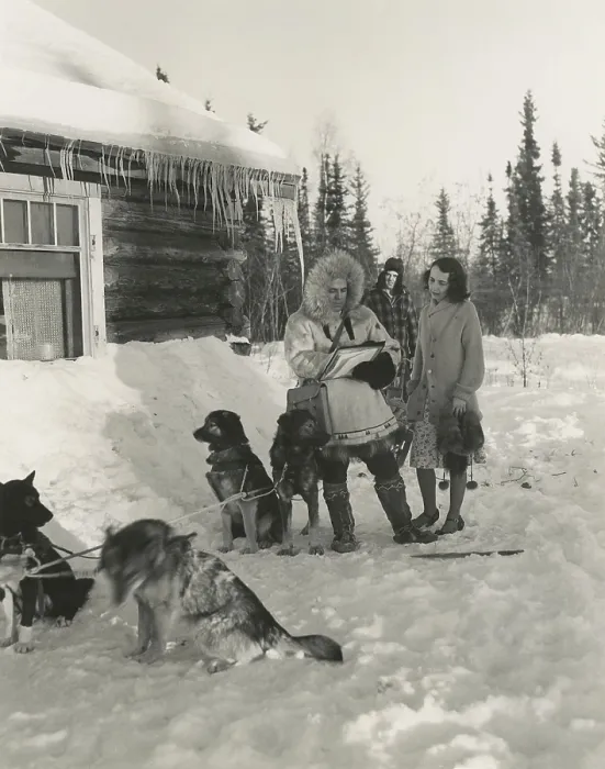 Framed Print : 1940s Census taker in Fairbanks, Alaska. He traveled by dog sled to reach this woman's home