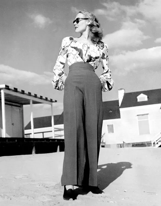 Framed Print : 1940s Fashion: a peasant top with blousson sleeves and a tropical floral pattern with high-waisted pants, 1945.. Courtesy: CSU Archives / Everett Collection Framed Print : 1940s Fashion: a peasant top with blousson sleeves and a tropical floral pattern with high-waisted pants, 1945.. Courtesy: CSU Archives / Everett Collection