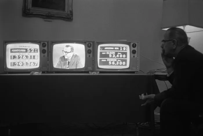 Framed Print : 1964 Presidential Election. President Lyndon Johnson watches election returns on three television sets in his suite at the Driskill Hotel, Austin, Texas. Nov. 3, 1964