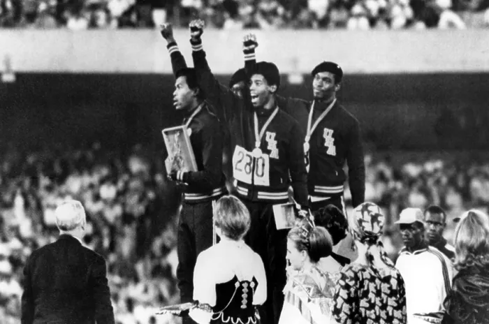 Framed Print : 1968 Olympics, 4x100 Men's Relay Team gives Black Power salute upon receiving Gold Medals. (L-R) Lee Evans, Ronald Freeman, Larry James, Vincent Matthews