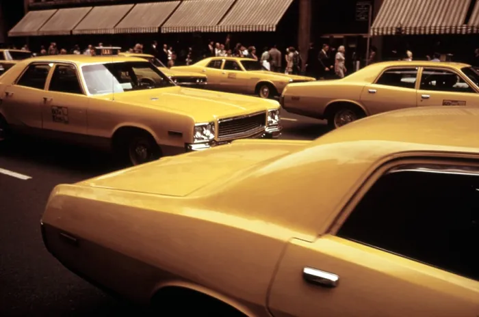 Framed Print : 1970s America. Yellow taxi cabs on 5th Avenue near 48th Street. Manhattan, New York City, ca. 1972