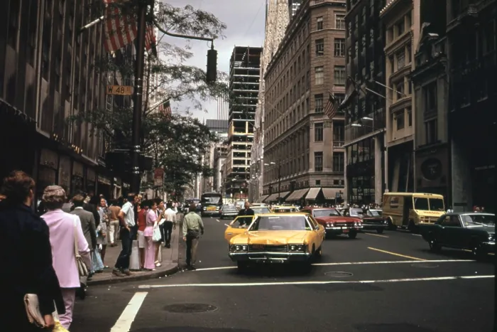 Framed Print : 1970s America. Yellow taxi cabs on the corner of 5th Avenue and 48th Street. Manhattan, New York City, ca. 1972