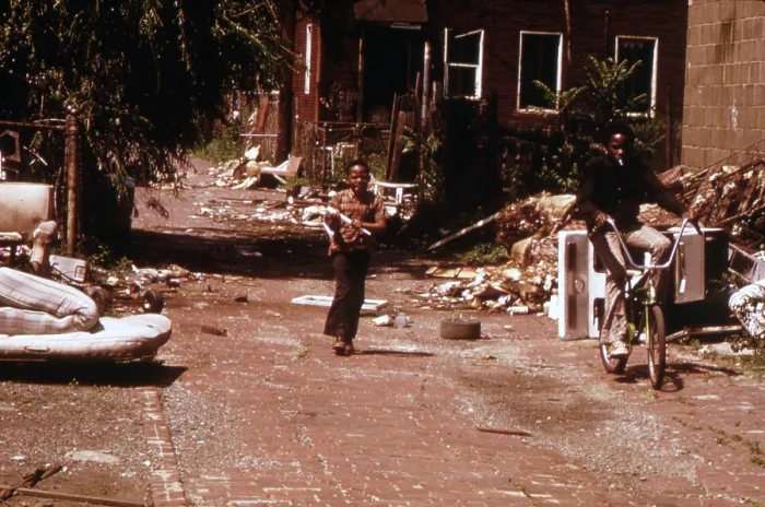 Framed Print : 1970s America. Two young boys pass through a trash-strewn alley of Chicago, ca. early 1973s Framed Print : 1970s America. Two young boys pass through a trash-strewn alley of Chicago, ca. early 1973s