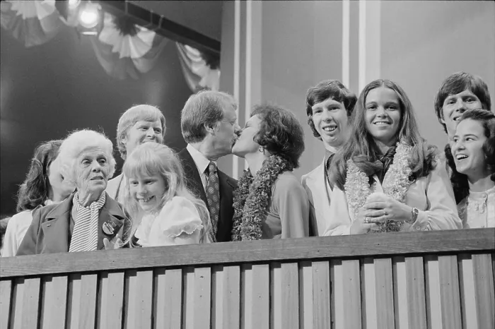 Framed Print : 1976 Democratic Convention. Jimmy and Rosalynn Carter kissing, surrounded by family, including young daughter Amy and mother Lillian Carter Framed Print : 1976 Democratic Convention. Jimmy and Rosalynn Carter kissing, surrounded by family, including young daughter Amy and mother Lillian Carter