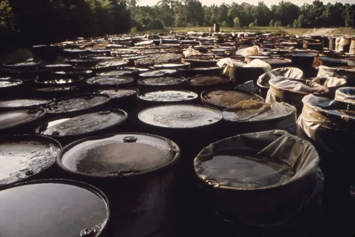 Framed Print : Some of 3 000 drums containing hazardous industrial waste in storage for over 6 months in a swampy field near Ville Platte Louisiana. The waste was brought in from Houston Texas