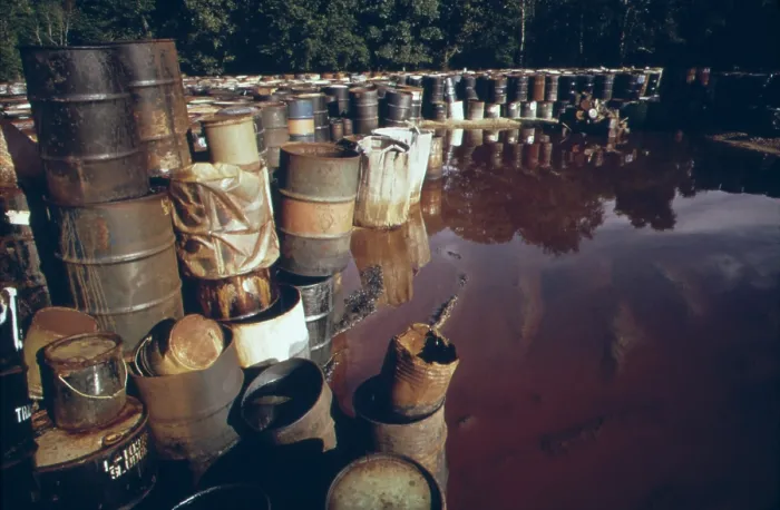 Framed Print : Some of 3 000 drums containing hazardous industrial waste in storage for over 6 months in a swampy field near Ville Platte Louisiana. The waste was brought in from Houston Texas
