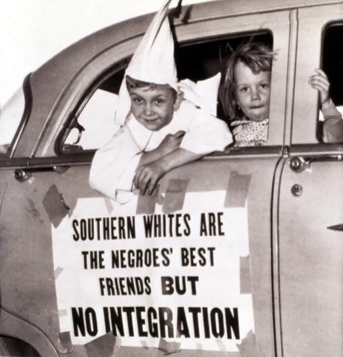 Framed Print : 4 / 14 / 56--MACON, GEORGIA: Perry Blevens, age 7, all decked out in his Ku Klux Klansman robes, rides in the motorcade staged here by the KKK 4 / 14 Framed Print : 4 / 14 / 56--MACON, GEORGIA: Perry Blevens, age 7, all decked out in his Ku Klux Klansman robes, rides in the motorcade staged here by the KKK 4 / 14
