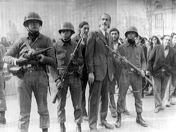 Framed Print : 6 / 29 / 73--SANTIAGO: Loyalist troops flank Defense Minister Jose Toha during a thwarted military uprising outside Chile's presidential palace Framed Print : 6 / 29 / 73--SANTIAGO: Loyalist troops flank Defense Minister Jose Toha during a thwarted military uprising outside Chile's presidential palace