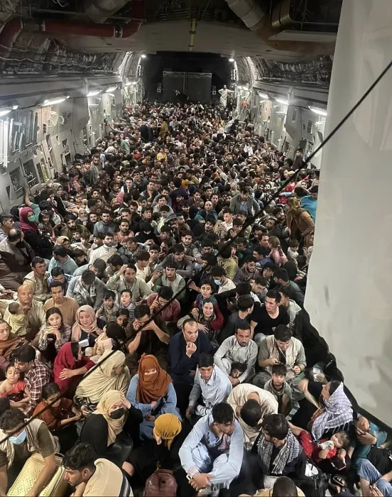 Framed Print : 823 Afghan refugees inside a US Air Force C-17 enroute from Kabul to Qatar on Aug. 15, 2021