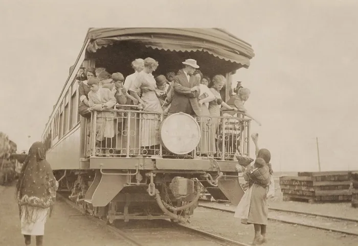 Framed Print : Acoma Indians sell their wares to Euro-American tourists on a train in New Mexico, 1912. Photo by Hugh Mear Neighbor (BSLOC_2019_9_83)