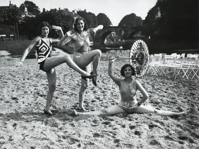 Framed Print : Acrobatic French women pose in the latest fashionable bathing suits on the sand beach at Dieppe. Ca. 1925. (BSLOC_2015_17_202)