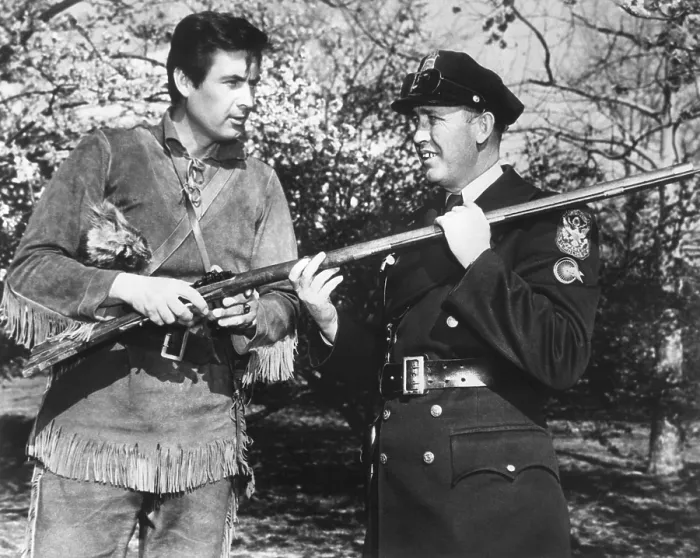 Framed Print : Actor Fess Parker in the frontier costume of Davy Crocket with a White House policeman Framed Print : Actor Fess Parker in the frontier costume of Davy Crocket with a White House policeman
