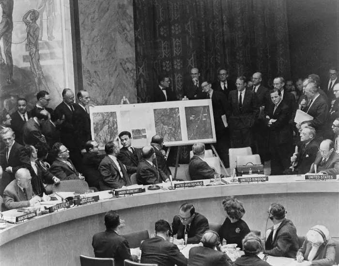 Framed Print : Adlai Stevenson describes location of missile sites in Cuba using aerial photographs during a United Nations Security Council meeting in New York. October 25, 1962