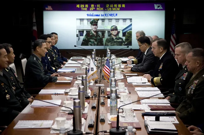 Framed Print : US Admiral Mike Mullen center right sits across the table from his South Korean counterpart center left to discuss transferring wartime operational control of Korean troops to Framed Print : US Admiral Mike Mullen center right sits across the table from his South Korean counterpart center left to discuss transferring wartime operational control of Korean troops to