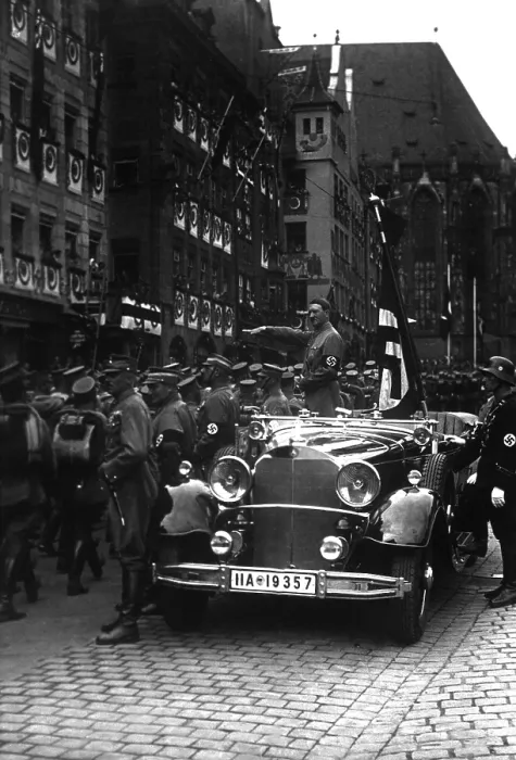 Framed Print : Adolf Hitler salutes parading Nazi Party storm troopers in Nuremberg, Nov. 5, 1935. (BSLOC_2013_11_11)