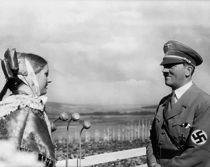 Framed Print : Adolf Hitler with a young woman in folk costume at the 1935 Erntedankfest. The Erntedankfest was an important component of Nazi, blood-and-soil ideology Framed Print : Adolf Hitler with a young woman in folk costume at the 1935 Erntedankfest. The Erntedankfest was an important component of Nazi, blood-and-soil ideology