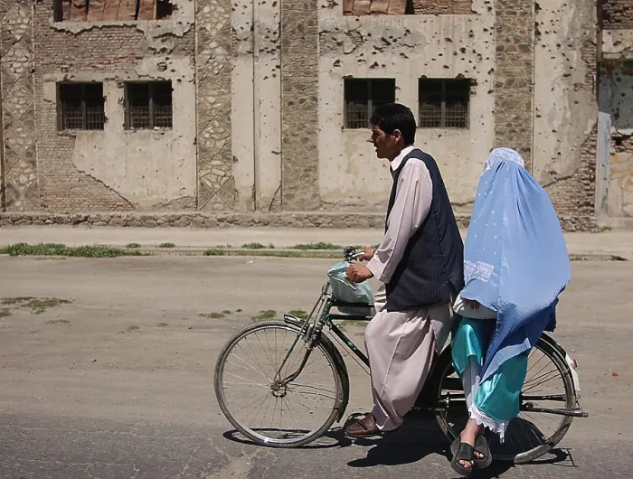 Framed Print : An Afghani couple rides a bicycle through the streets of Kabul Afghanistan after the Taliban were ousted. May 10 2002. Photo by:Everett Collection(BSLOC_2011_6_92)