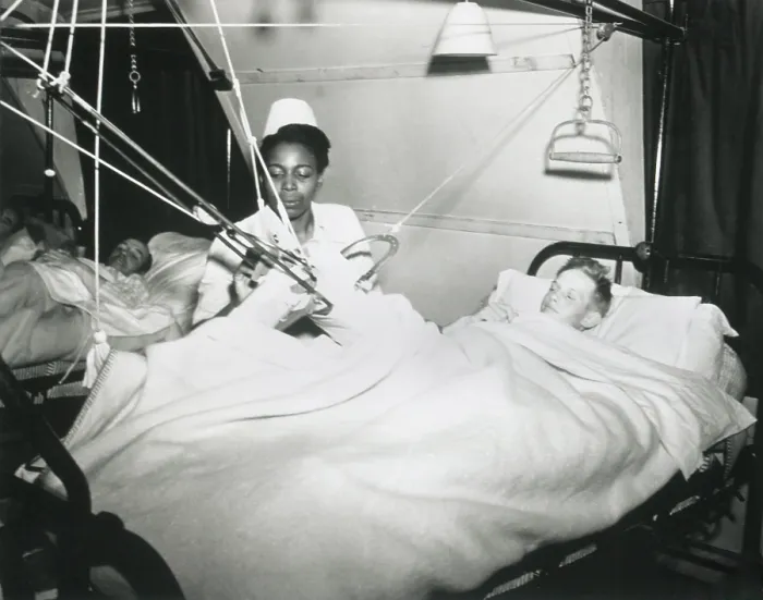 Framed Print : African America U.S. Army Nurse treats a German POW at a prisoner-of-war hospital in England. Oct. 7, 1944