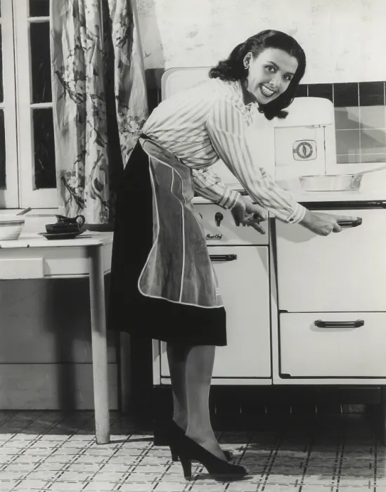 Framed Print : African American actress Lena Horne at a gas stove. She was promoted fuel conservation during World War 2, ca. 1942-45. (BSLOC_2013_14_160)