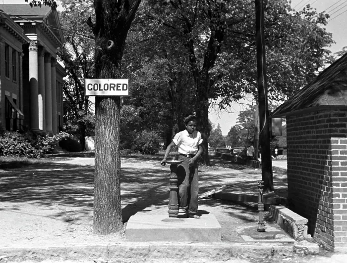 Framed Print : African American boy at a water fountain, the sign reads Colored, original caption: Drinking fountain on the county courthouse lawn, Halifax, North Carolina